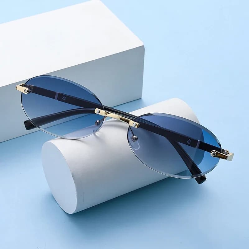Popular Women Men Shades Oval Sun Glasses for Female Male Summer Traveling UV400 Rimless Sunglasses Round Fashion Gafas De Sol